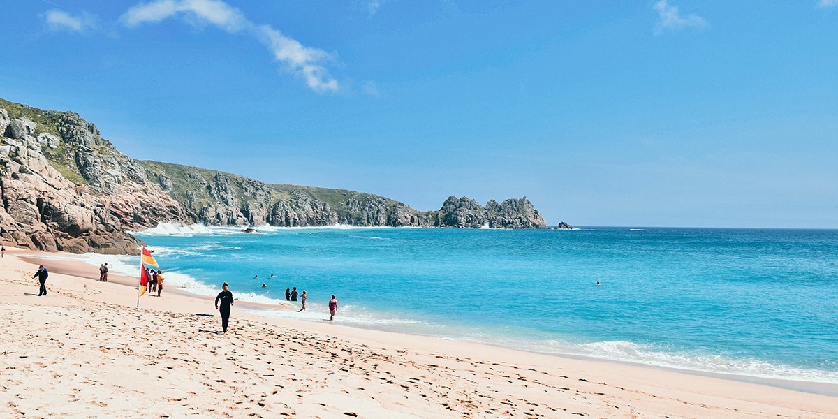 beach side picture with people running 
